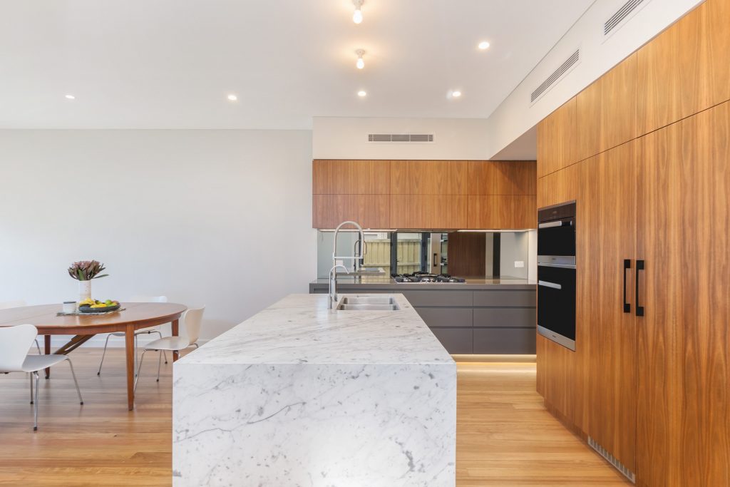 Annandale, Timber Veneer and polyurethane kitchen with a Carrara Marble feature island