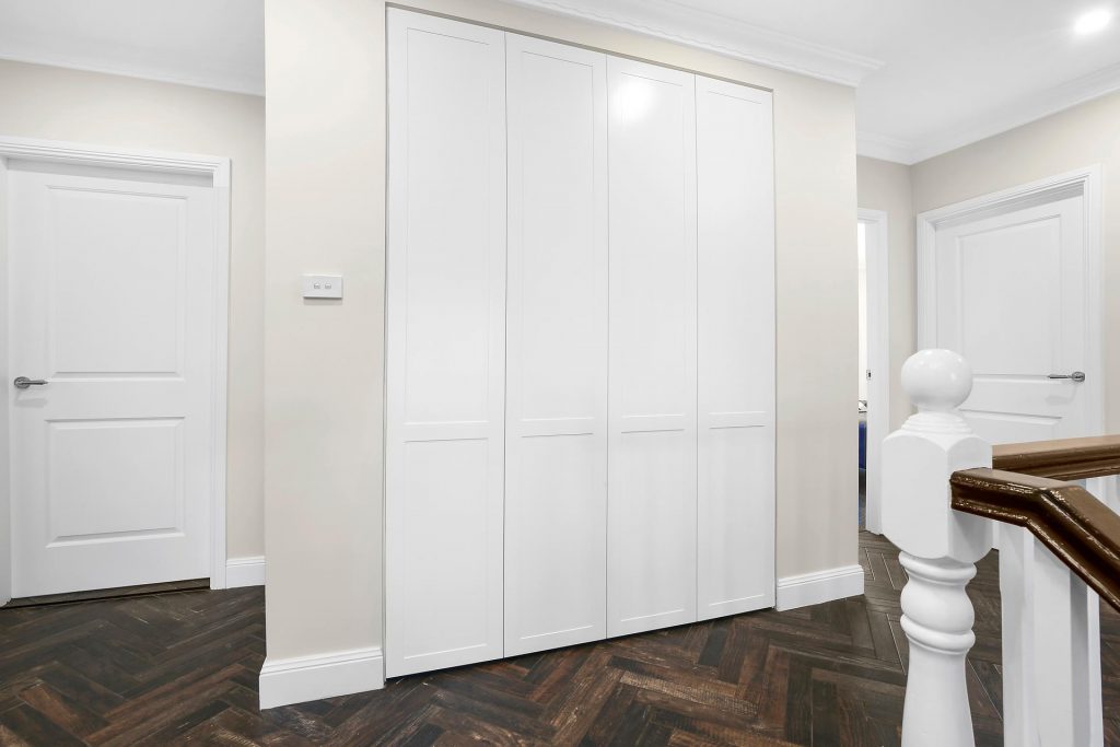 Shaker Style linen closet with push open doors - Georges Hall, Sydney