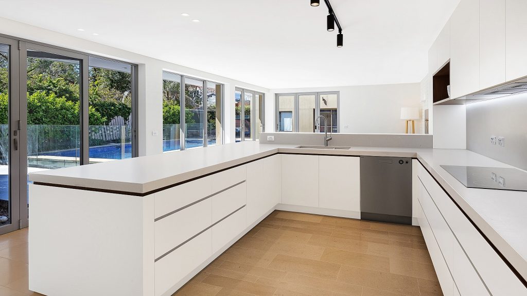 Dover Heights Kitchen, Polyurethane and Likewood Timber Grain kitchen with a sleek concrete Caesarstone bench.