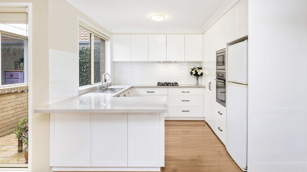 AFTER Wattle Grove Renovation, Shaker style kitchen with Caesarstone benchtop