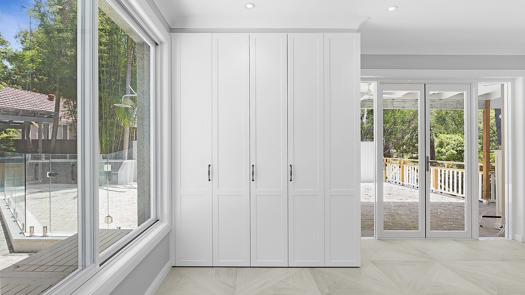Polyurethane Shaker style cabinets with bi-folding doors to laundry area - Oatley, Sydney