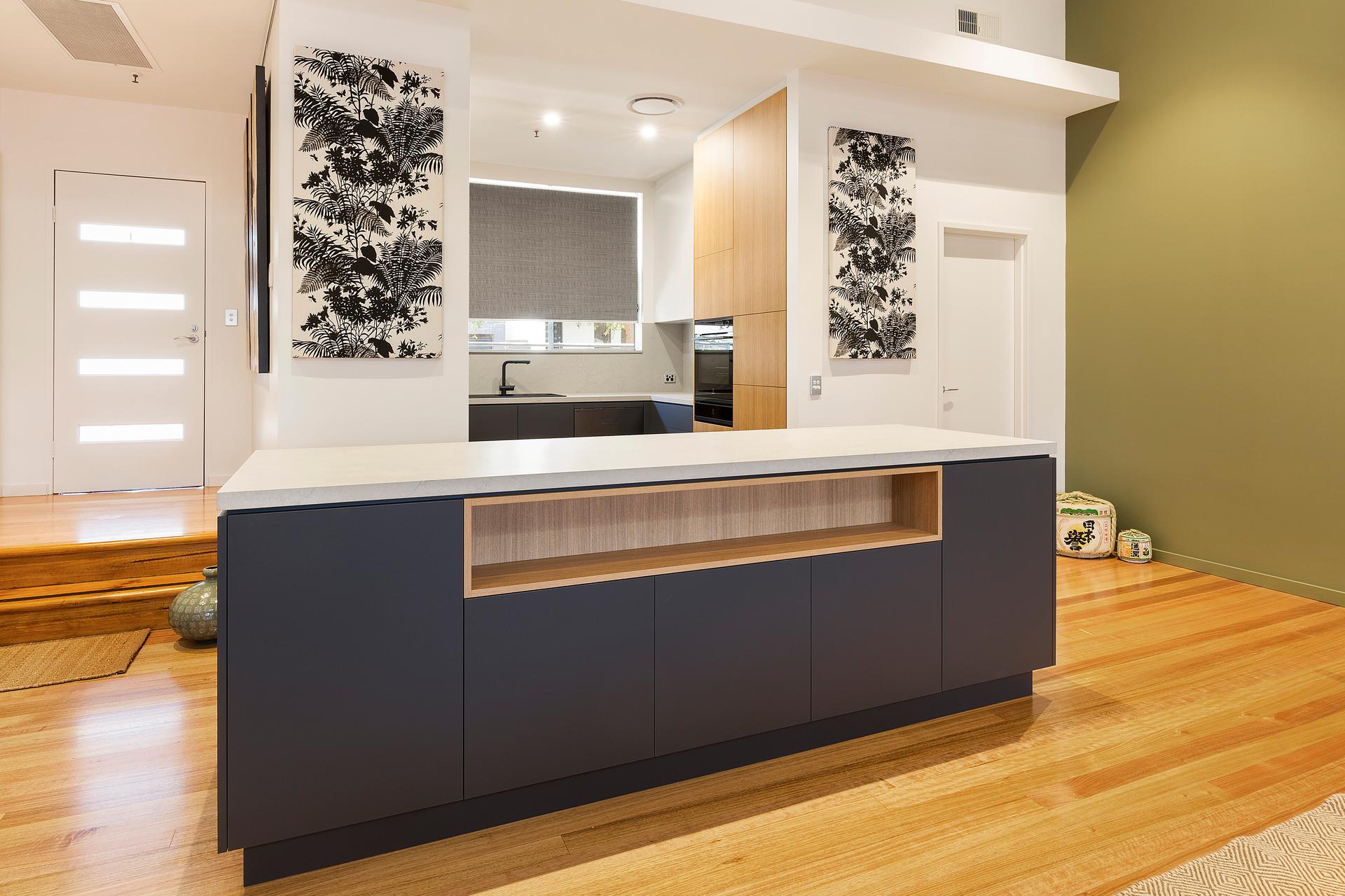 Lilyfield, Laminate kitchen with push open doors and an island bench with a Smartstone top in Pelle Grigio