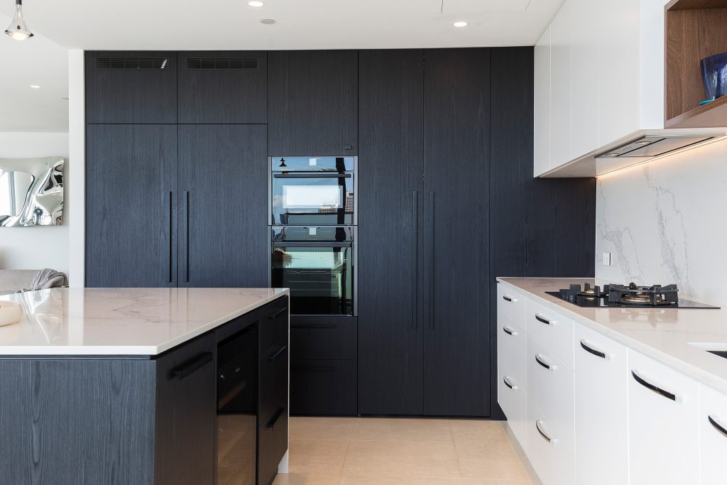 Milsons Point, Veneer Kitchen featuring a curved island bench with stone tops and splashback in Calcutta Plato